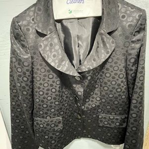 Black skirt suit with circle print design.